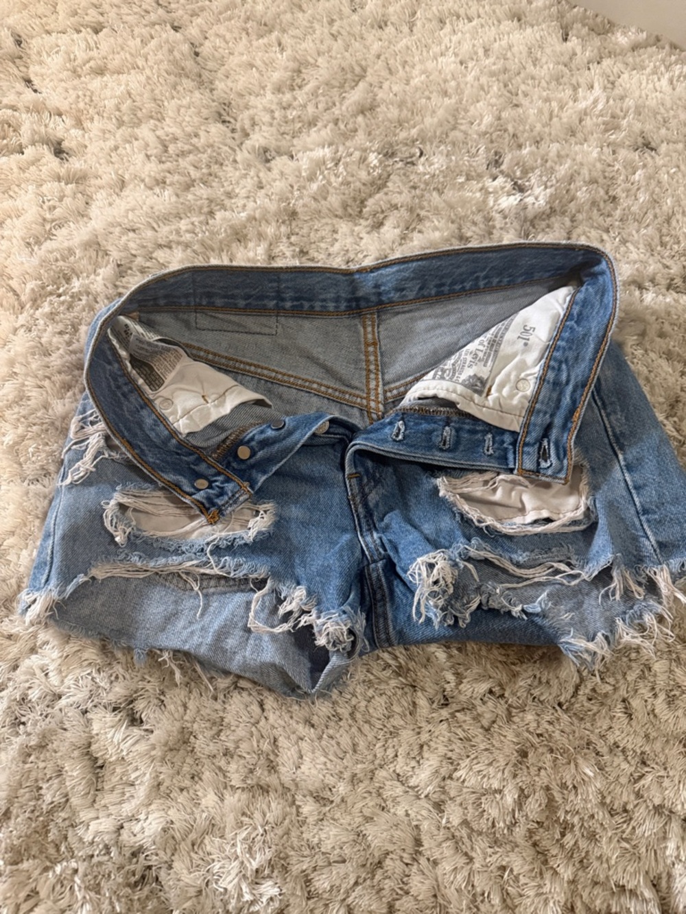 Distressed Light Blue Denim Shorts - Women's